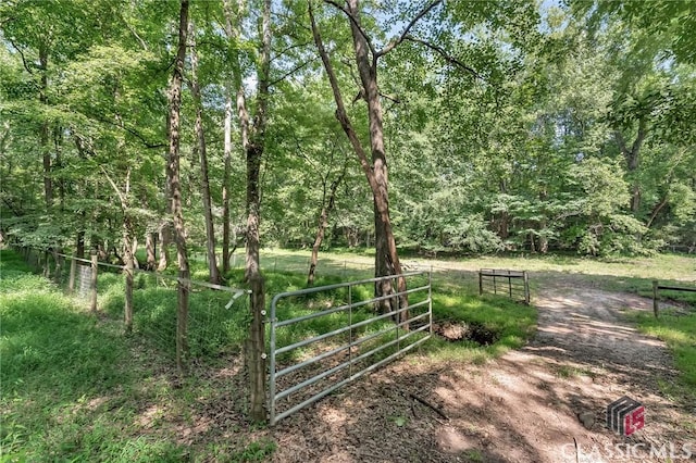 exterior space featuring a gate and fence