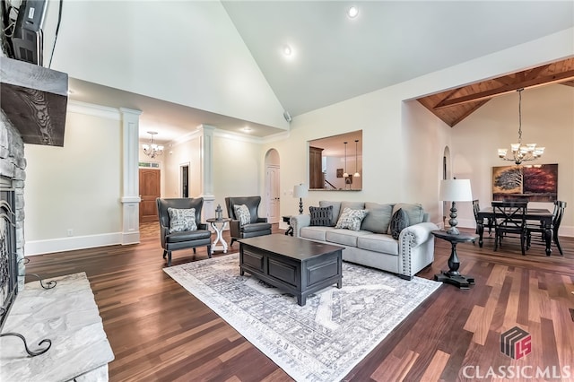 living room with dark wood-type flooring, a fireplace, high vaulted ceiling, and a notable chandelier