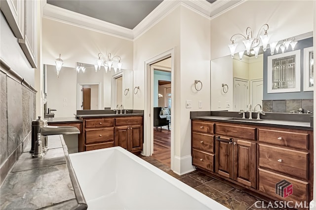 bathroom featuring hardwood / wood-style flooring, a tub, crown molding, and vanity