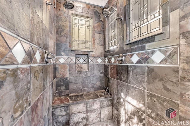 bathroom featuring a tile shower