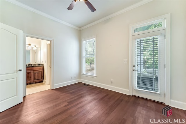 unfurnished bedroom featuring ceiling fan, wood-type flooring, ensuite bath, access to outside, and ornamental molding