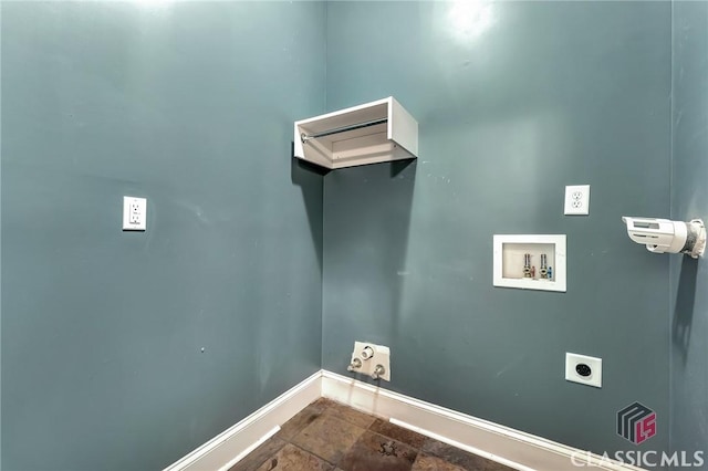 clothes washing area featuring laundry area, hookup for an electric dryer, gas dryer hookup, washer hookup, and baseboards