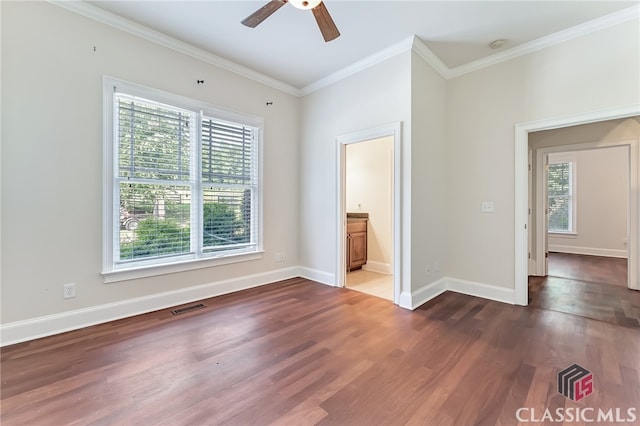 unfurnished room with dark wood-type flooring, ornamental molding, and ceiling fan