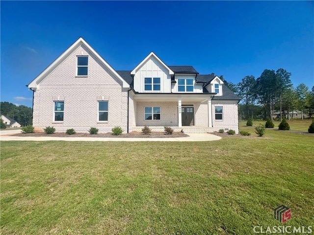 craftsman-style house with a front yard