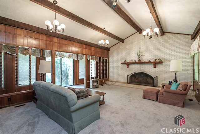 living room with vaulted ceiling with beams, carpet floors, and brick wall