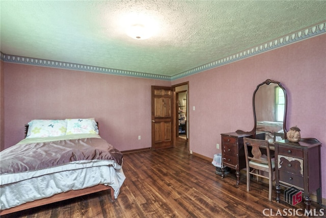 bedroom featuring a textured ceiling and dark hardwood / wood-style floors