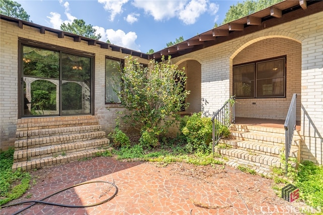 entrance to property with a patio area