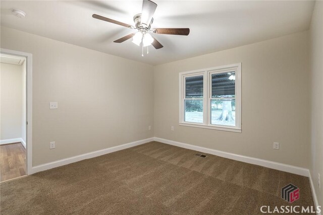 218 E Vine St, Monroe, GA 30655 - empty room featuring baseboards, carpet flooring, ceiling fan, and visible vents