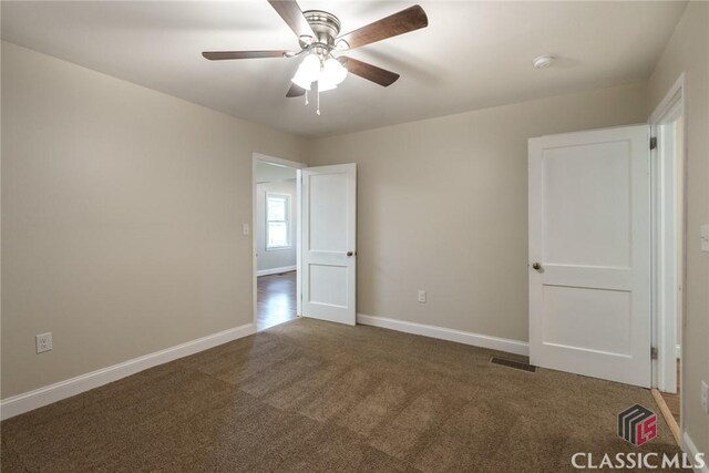 218 E Vine St, Monroe, GA 30655 - carpeted empty room with baseboards, a ceiling fan, and visible vents