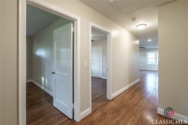 218 E Vine St, Monroe, GA 30655 - corridor with baseboards, attic access, and wood finished floors