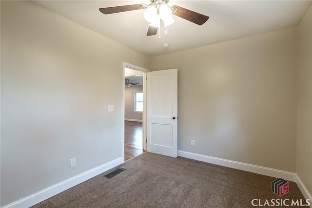 218 E Vine St, Monroe, GA 30655 - carpeted spare room featuring visible vents, ceiling fan, and baseboards