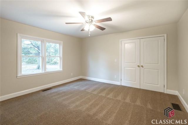 218 E Vine St, Monroe, GA 30655 - interior space featuring carpet, visible vents, and baseboards