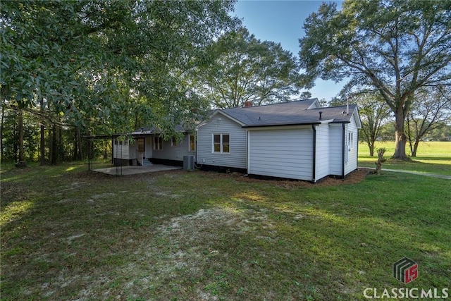 218 E Vine St, Monroe, GA 30655 - back of house with a yard, central AC, and a patio