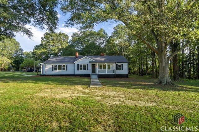 218 E Vine St, Monroe, GA 30655 - bungalow-style house featuring a front yard