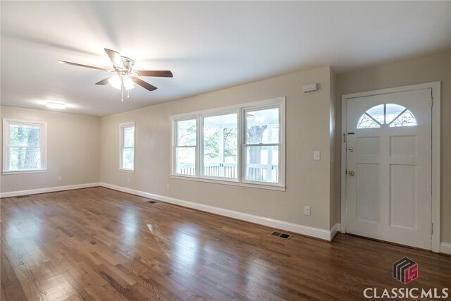 218 E Vine St, Monroe, GA 30655 - foyer entrance with ceiling fan, visible vents, baseboards, and a healthy amount of sunlight