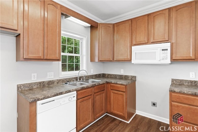 kitchen with dark hardwood / wood-style flooring, sink, white appliances, and crown molding