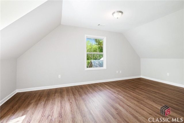 bonus room featuring hardwood / wood-style flooring and vaulted ceiling