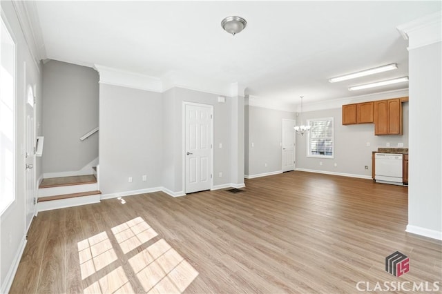 unfurnished living room with a notable chandelier, ornamental molding, and light wood-type flooring