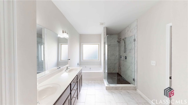 bathroom with vanity and separate shower and tub