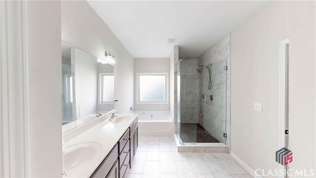 bathroom with a bath, a shower stall, marble finish floor, and a sink