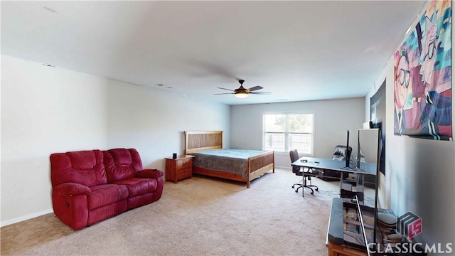 bedroom with carpet flooring, baseboards, and a ceiling fan