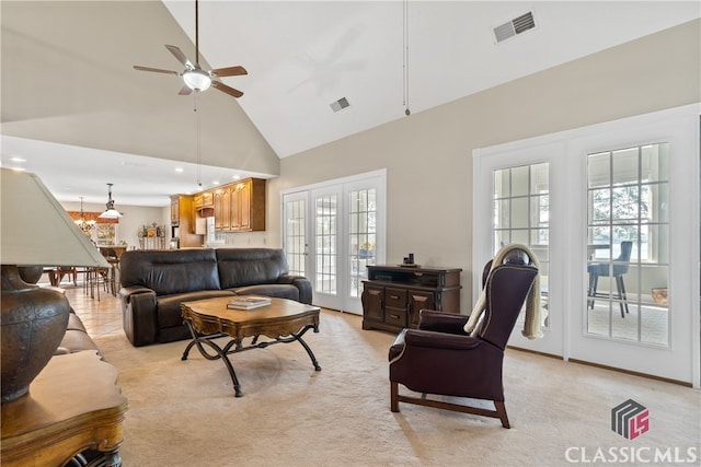 living room featuring french doors, high vaulted ceiling, plenty of natural light, and ceiling fan