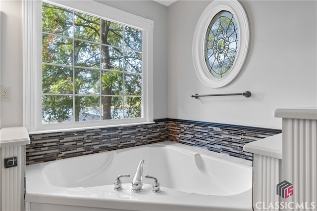 bathroom with a tub to relax in