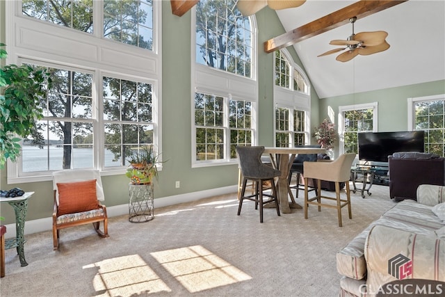 sunroom / solarium with vaulted ceiling with beams and ceiling fan