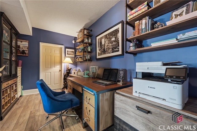 office featuring a textured ceiling and wood-type flooring