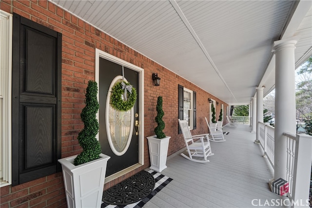 wooden terrace with a porch