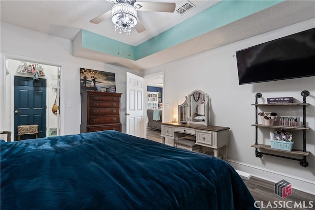 bedroom featuring dark hardwood / wood-style floors and ceiling fan