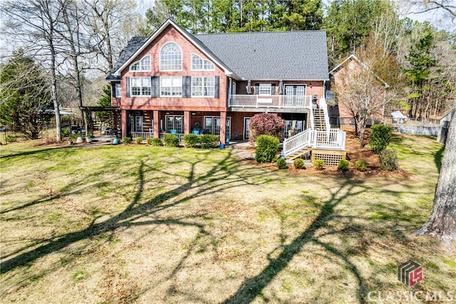 rear view of property featuring a lawn