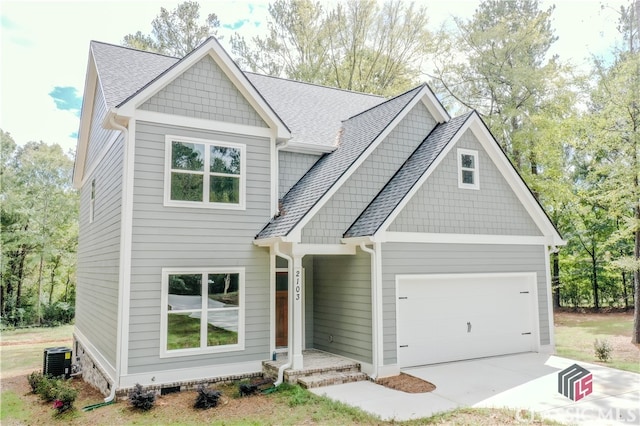 craftsman-style home featuring a garage and central AC