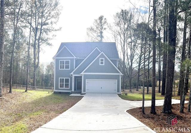 view of front of home with a front yard and a garage