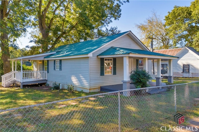 view of front of home with a front lawn and a porch