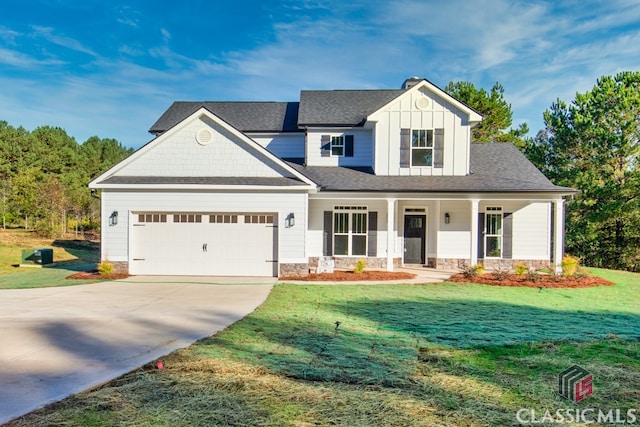 craftsman-style home featuring a front yard, a porch, and a garage