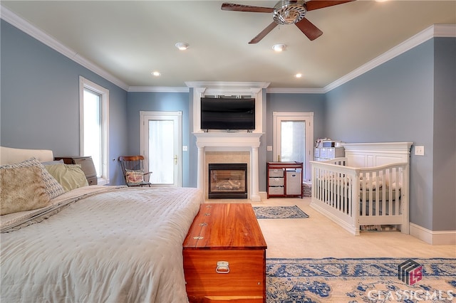 bedroom with ornamental molding, carpet, and ceiling fan