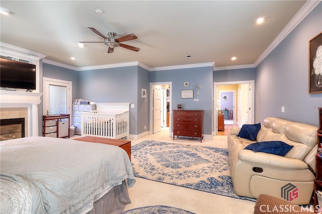 carpeted bedroom featuring ceiling fan and ornamental molding