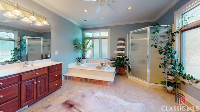 bathroom featuring plus walk in shower, tile patterned flooring, crown molding, vanity, and ceiling fan