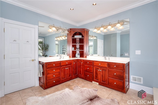 bathroom featuring vanity, crown molding, and tile patterned flooring