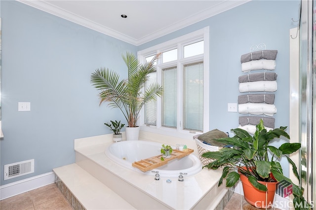 bathroom with a bathtub, crown molding, and tile patterned floors