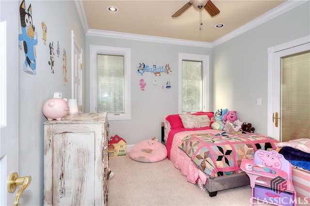 bedroom with ceiling fan, crown molding, and multiple windows