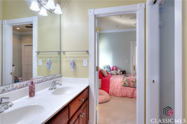 bathroom with vanity and crown molding