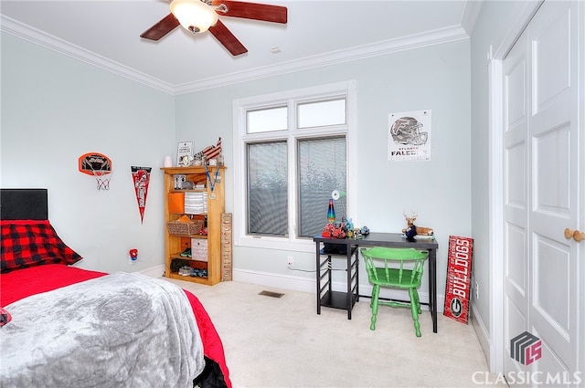 bedroom featuring ornamental molding, carpet, and ceiling fan