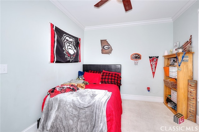 carpeted bedroom featuring crown molding and ceiling fan