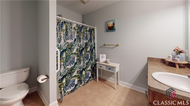 bathroom with vanity, toilet, tile patterned flooring, and a shower with shower curtain