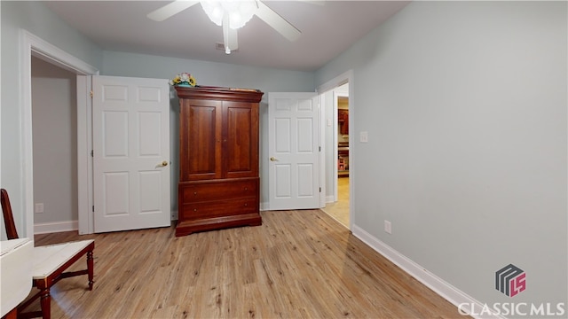 unfurnished bedroom with light hardwood / wood-style flooring and ceiling fan