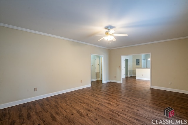 empty room featuring dark wood-type flooring, ceiling fan, and crown molding