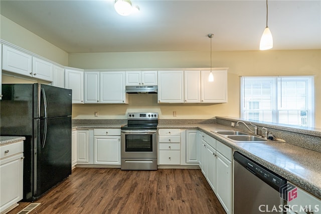 kitchen featuring white cabinetry, appliances with stainless steel finishes, sink, and hanging light fixtures