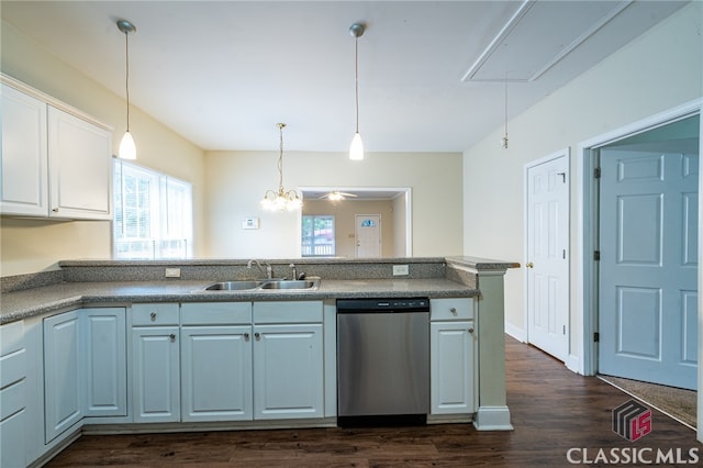 kitchen with white cabinetry, sink, decorative light fixtures, stainless steel dishwasher, and dark wood-type flooring